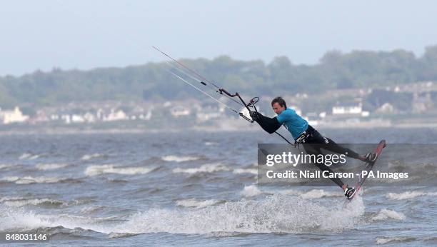 Kite surfer takes to the waves on Dublins Dollymount Strand in Dublin as temperatures rise across the country. PRESS ASSOCIATION Photo. Picture date:...