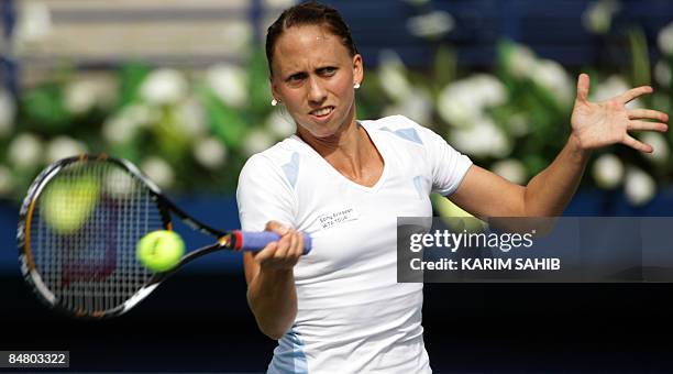 Germany's Julia Schruff returns the ball to Petra Kvitova of the Czech Republic during their singles tennis match on the first day of the WTA Dubai...