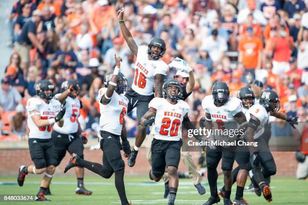 Members of the Mercer Bears celebrate after recovering a fumble during their game against the Auburn Tigers at Jordan-Hare Stadium on September 16,...