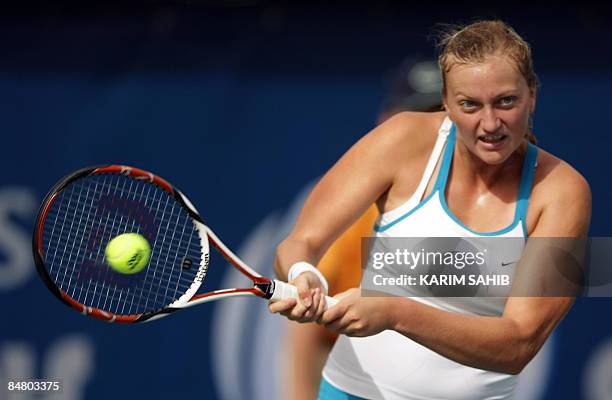 Petra Kvitova of the Czech Republic returns the ball to Germany's Julia Schruff during their singles tennis match on the first day of the WTA Dubai...