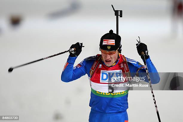 Maxim Tchoudov of Russia celebrates after he cross the finish line during the Men's 12,5 km pursuit of the IBU Biathlon World Championships on...