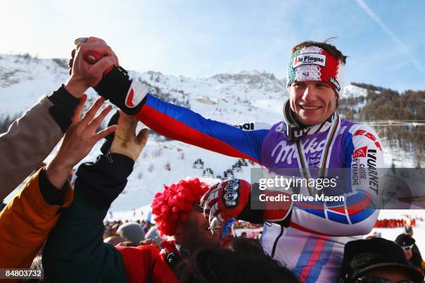 Silver medal winner Julien Lizeroux of France celebrates with fans and team mates following the Men's Slalom event held on the Face de Bellevarde...