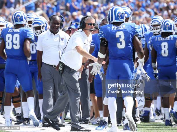 Mike Norvell, head coach of the Memphis Tigers celebrates with Anthony Miller # of the Memphis Tigers after a touchdown against the UCLA Bruins on...