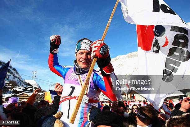 Silver medal winner Julien Lizeroux of France celebrates with fans and team mates following the Men's Slalom event held on the Face de Bellevarde...