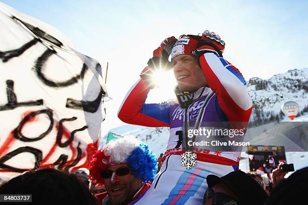 Silver medal winner Julien Lizeroux of France celebrates with fans and team mates following the Men's Slalom event held on the Face de Bellevarde...