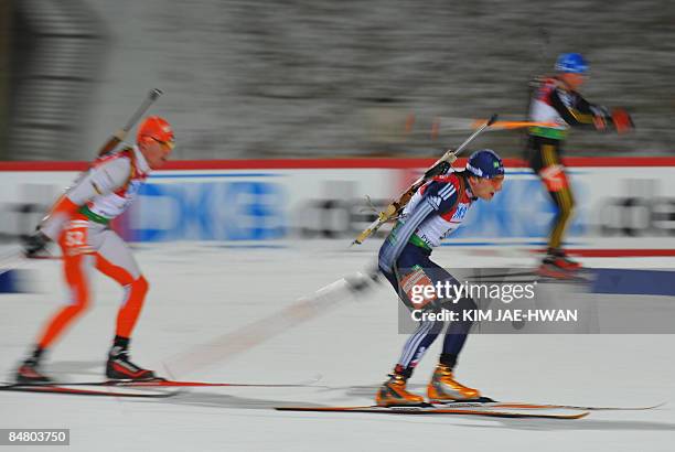 Competitors ski during the men's 12.5 km pursuit event at the IBU World Biathlon Championships in Pyeongchang, east of Seoul on February 15, 2009....