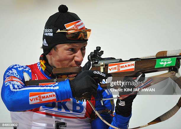 Maxim Tchoudov of Russia shoots during the men's 12.5 km pursuit event at the IBU World Biathlon Championships in Pyeongchang, east of Seoul on...