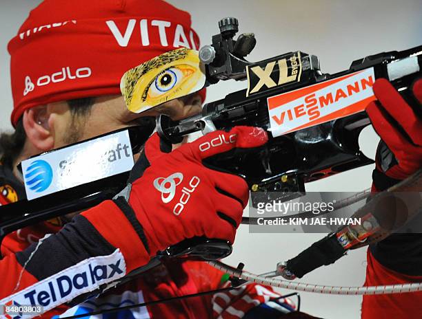 Norway's Ole Einar Bjoerndalen shoots during the men's 12.5 km pursuit event at the IBU World Biathlon Championships in Pyeongchang, east of Seoul on...
