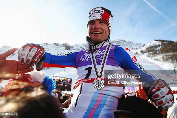 Silver medal winner Julien Lizeroux of France celebrates with fans and team mates following the Men's Slalom event held on the Face de Bellevarde...