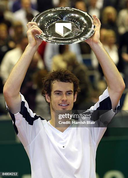 Andy Murray of Great Britain celebrates victory with the trophy after the singles final match against Rafael Nadal of Spain during day seven of the...