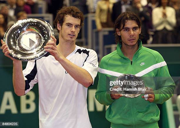 Andy Murray of Great Britain celebrates victory with the winner's trophy with Rafael Nadal of Spain with the runners up's trophy after the singles...