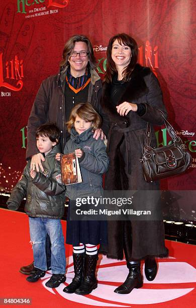 Silvia Laubenbacher, Percy Hoven and their children pose for the media during the premiere of the movie 'Lilli The Witch - The Dragon And The Magical...