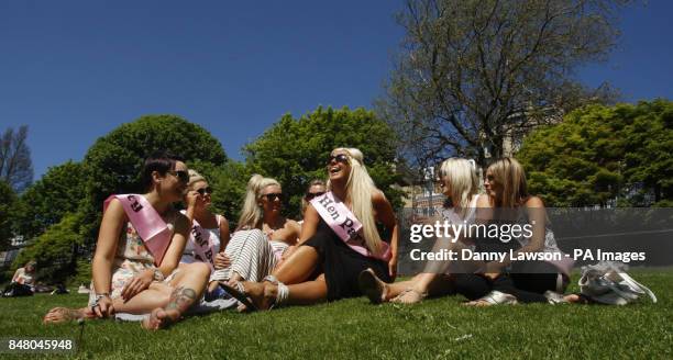 Gael Sim and friends enjoy the hot weather in Princes Street Gardens in Edinburgh, during a hen party for Stacy McQuiston .