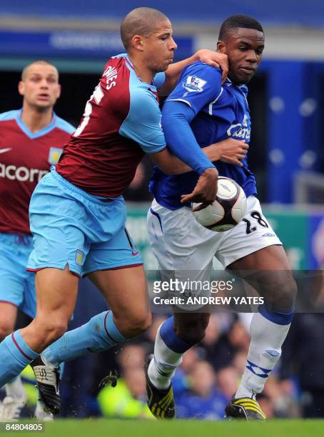 Everton's Nigerian forward Victor Anchebe vies with Aston Villa's English defender Curtis Davies during the FA cup fifth round football match at...