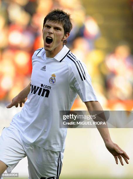 Real Madrid's Dutch Klaas Jan Huntelaar celebrates after scoring against Sporting Gijon during their Spanish first league football match at the...