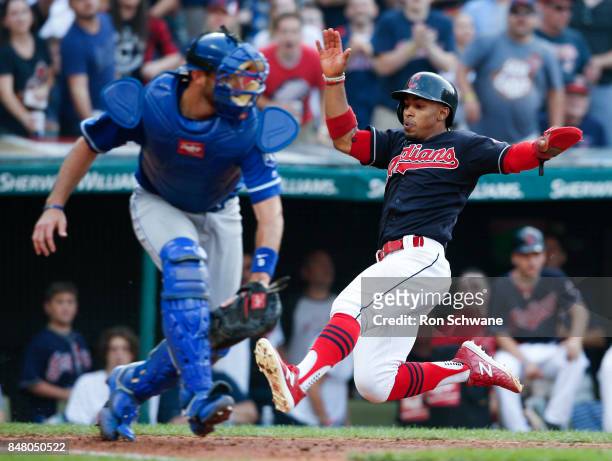Francisco Lindor of the Cleveland Indians scores past Drew Butera of the Kansas City Royals on a single by Austin Jackson during the sixth inning at...