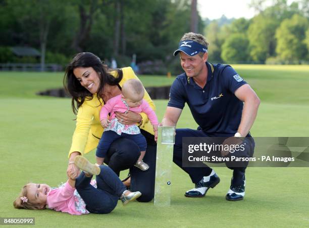 England's Luke Donald celebrates winning the BMW PGA Championship with his wife Diane Antonopoulos and his children Elle and Sophia at Wentworth Golf...