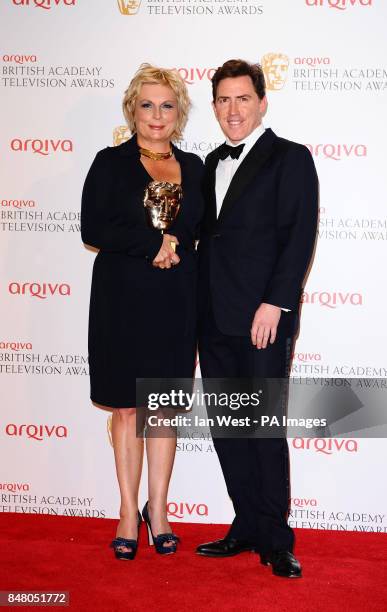 Jennifer Saunders with the award for Female performance in a comedy programme and Rob Brydon at the Arqiva British Academy Television Awards 2012 at...