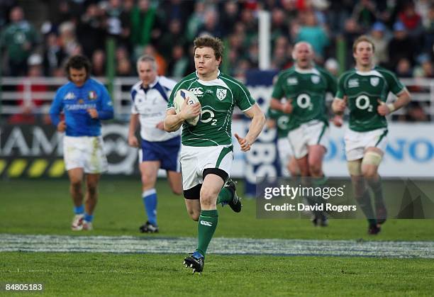 Brian O'Driscoll of Ireland breaks away to score a try during the RBS Six Nations match between Italy and Ireland at Stadio Flaminio on 15th...