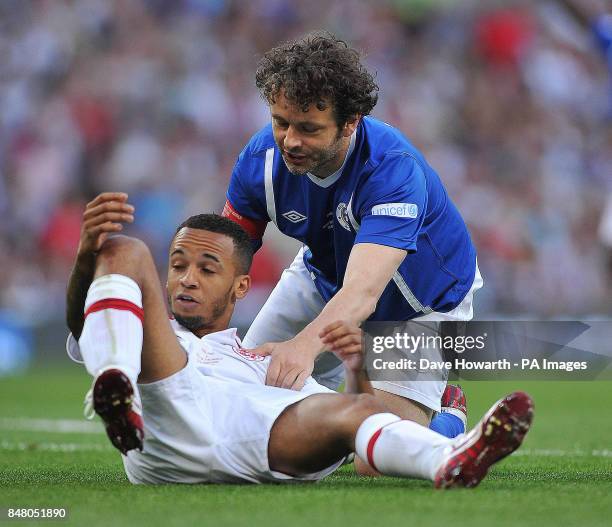 Michael Sheen and Aston Merrygold during the match at Old Trafford for Soccer Aid.