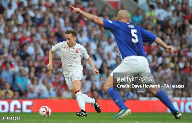 Olly Murs takes on Jaap Stam during the match at Old Trafford for Soccer Aid.