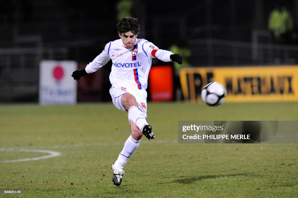 Lyon's midfielder Juninho kicks the ball