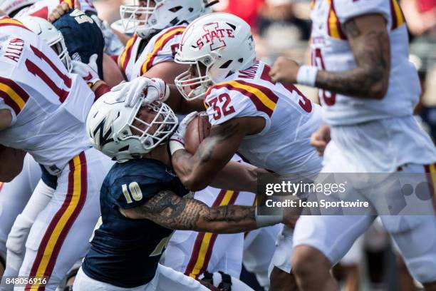 Iowa State Cyclones running back David Montgomery runs thru the tackle attempt of Akron Zips linebacker Brian Bell during the first quarter of the...