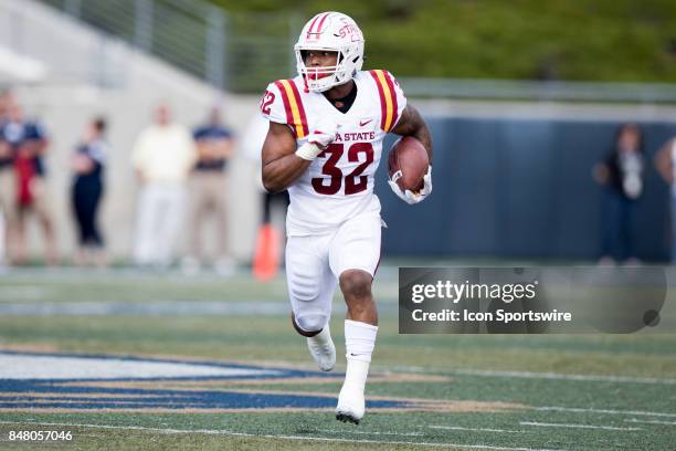 Iowa State Cyclones running back David Montgomery carries the football during the first quarter of the college football game between the Iowa State...