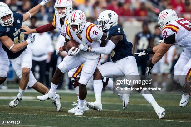 Akron Zips linebacker Ulysees Gilbert III makes a tackle on Iowa State Cyclones running back Mike Warren during the first quarter of the college...