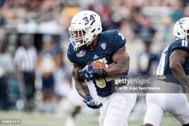 Akron Zips running back Warren Ball runs the football during the second quarter of the college football game between the Iowa State Cyclones and...