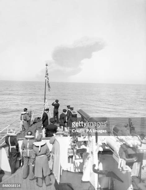 Spectators aboard HM Fleet minesweeper "Albacore" watch the great pall of smoke rise into the air from a distance of 9 miles, as Heligoland,...