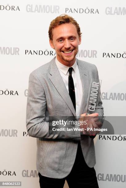 Tom Hiddleston with the Man of The Year award, at the 2012 Glamour Women of The Year Awards at Berkeley Square Gardens, London.