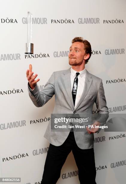 Tom Hiddleston with the Man of The Year award, at the 2012 Glamour Women of The Year Awards at Berkeley Square Gardens, London.