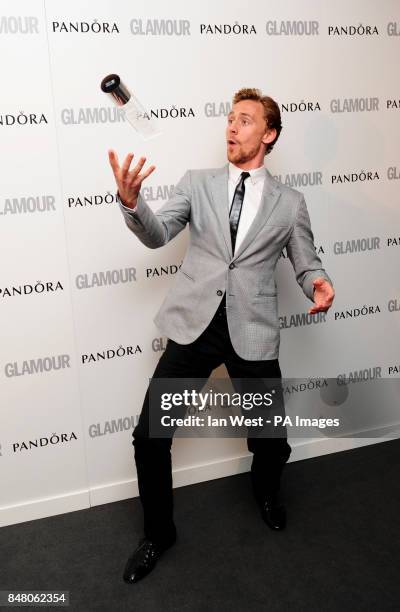 Tom Hiddleston with the Man of The Year award, at the 2012 Glamour Women of The Year Awards at Berkeley Square Gardens, London.