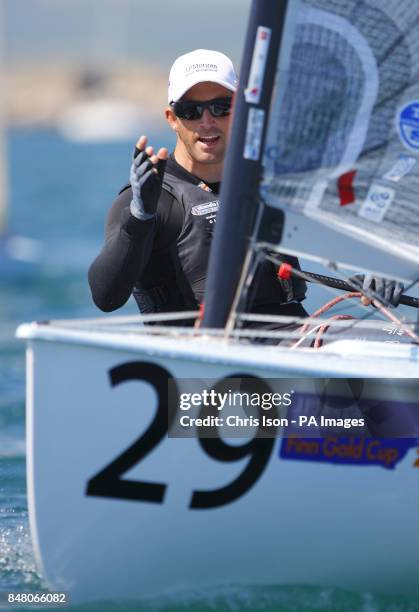 British Olympic Finn sailor Ben Ainslie on the water at the Weymouth and Portland National Sailing Academy.