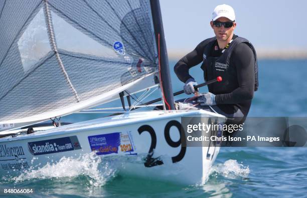 British Olympic Finn sailor Ben Ainslie on the water at the Weymouth and Portland National Sailing Academy.