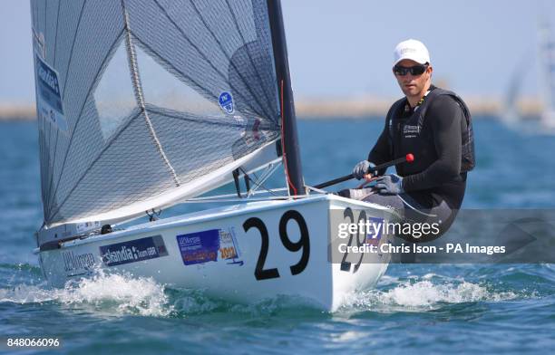 British Olympic Finn sailor Ben Ainslie on the water at the Weymouth and Portland National Sailing Academy.