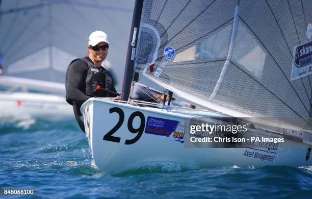 British Olympic Finn sailor Ben Ainslie on the water at the Weymouth and Portland National Sailing Academy.