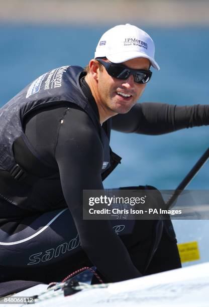British Olympic Finn sailor Ben Ainslie on the water at the Weymouth and Portland National Sailing Academy.