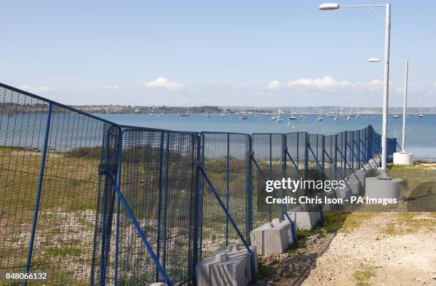 General view of security fencing being erected around the Weymouth and Portland National Sailing Academy.