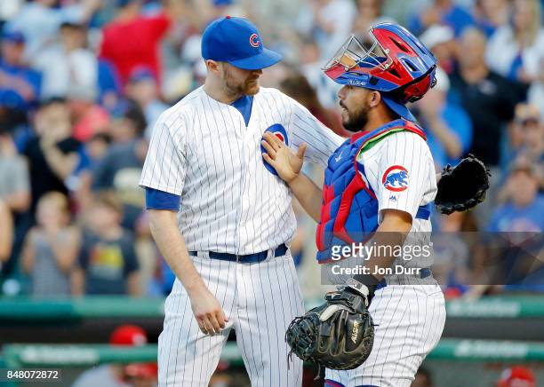 Wade Davis of the Chicago Cubs and Rene Rivera celebrate their win over the St. Louis Cardinals at Wrigley Field on September 16, 2017 in Chicago,...