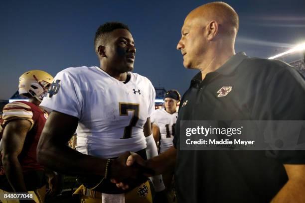 Head coach Steve Addazio of the Boston College Eagles shakes hands with Brandon Wimbush of the Notre Dame Fighting Irish after the Irish defeat the...