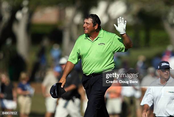 Fulton Allem waves to a cheering crowd as he walks up to the 18th green during the final round of the Allianz Championship at The Old Course at...