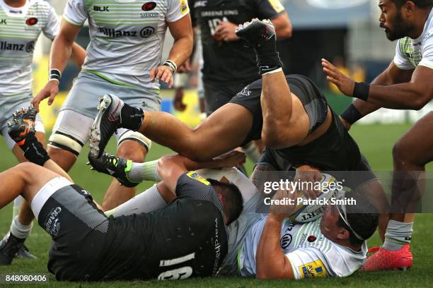 Vereniki Goneva of the Newcastle Falcons tackles Kieran Longbottom of the Saracens during a Aviva Premiership match between the Newcastle Falcons and...