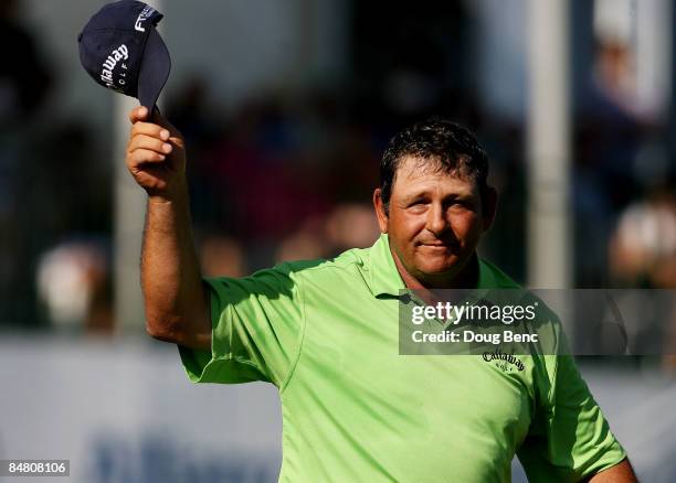 Fulton Allem waves to a cheering crowd on the 18th green after the final round of the Allianz Championship at The Old Course at Broken Sound Club on...