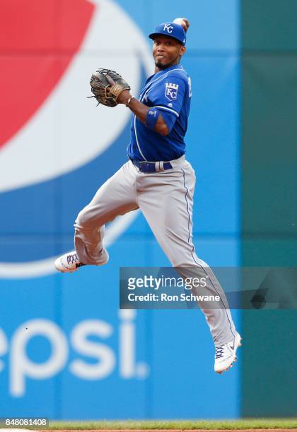 Alcides Escobar of the Kansas City Royals attempts to throw out Jay Bruce of the Cleveland Indians at first base during the seventh inning at...