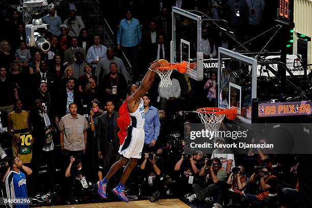 Dwight Howard of the Orlando Magic dunks on a 12-foot hoop during the Sprite Slam Dunk Contest on All-Star Saturday Night, part of 2009 NBA All-Star...