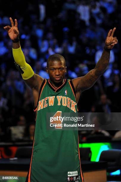 Nate Robinson of the New York Knicks waves to the crowd after winning the Sprite Slam Dunk Contest on All-Star Saturday Night, part of 2009 NBA...