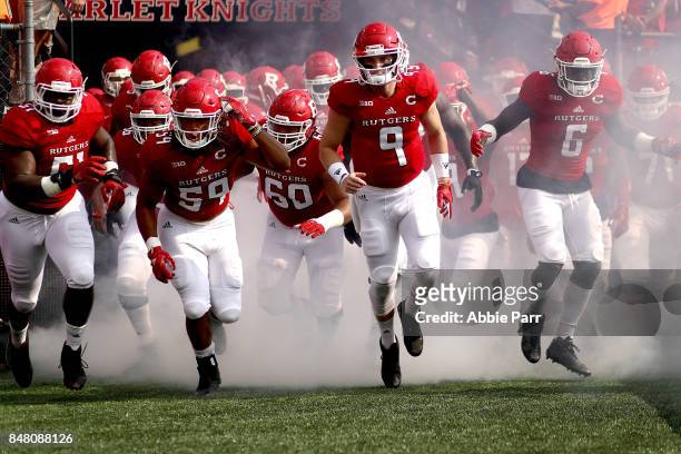 Kyle Bolin of the Rutgers Scarlet Knights and teammates take the field against the Morgan State Bears on September 16, 2017 at High Point Solutions...