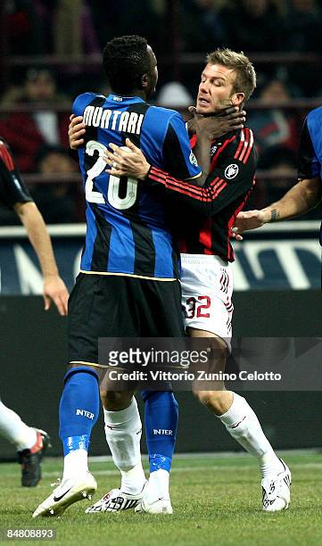 Sulley Ali Muntari and David Beckham in action during FC Inter Milan v AC Milan - Serie A match on February 15, 2009 in Milan, Italy.
